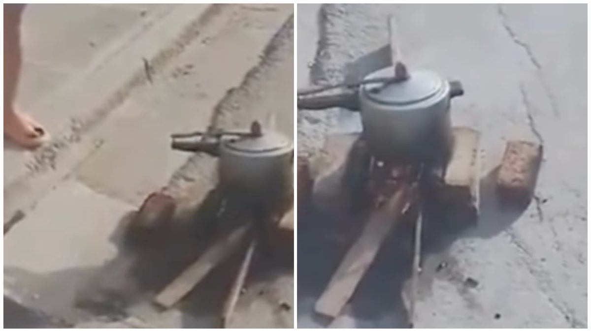 Madre cubana cocina con leña en la calle por crisis